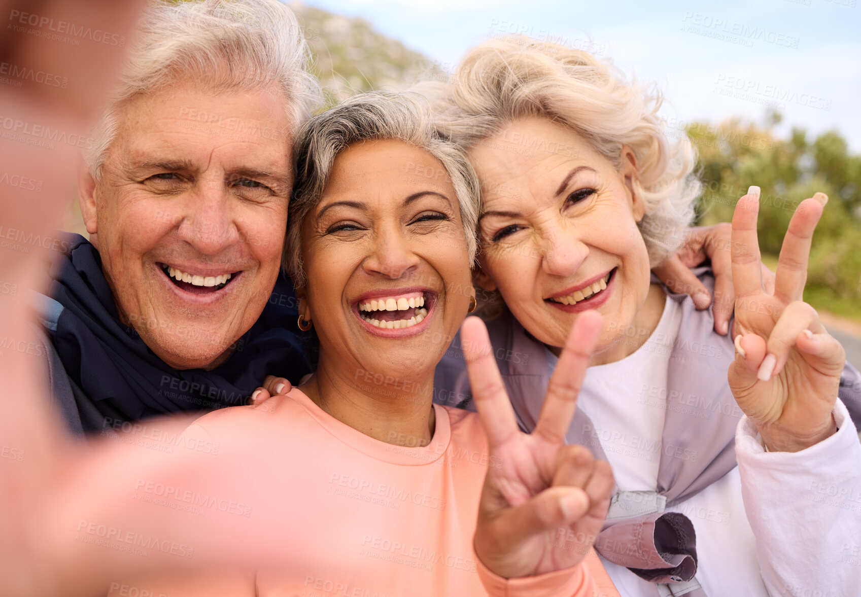 Buy stock photo Senior friends, fitness and selfie outdoor with peace sign, portrait and diversity on social media. Happy old man, women and photography for memory, emoji or profile picture for workout in retirement