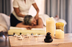 Massage, spa aroma candles and woman at beauty salon for wellness, spiritual service and body healing. Physiotherapy, aromatherapy flame and relax person with zen peace, calm fire or masseuse support