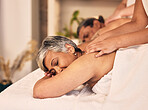 Relax, elderly and a couple at the spa for a massage together for peace, wellness or bonding. Luxury, hospitality or body care with a senior woman and man in a beauty salon for physical therapy