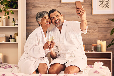 Buy stock photo Couple, selfie and champagne toast for spa massage, vacation or holiday celebration, love and social media. Wine glasses of excited senior people in profile picture at hotel for luxury or hospitality