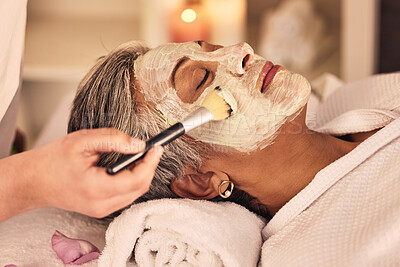 Buy stock photo Woman, spa and brush cream face mask for skincare treatment, relax or detox at beauty salon. Calm mature female client at wellness resort for facial cleaning, hydration cosmetics and peeling for glow