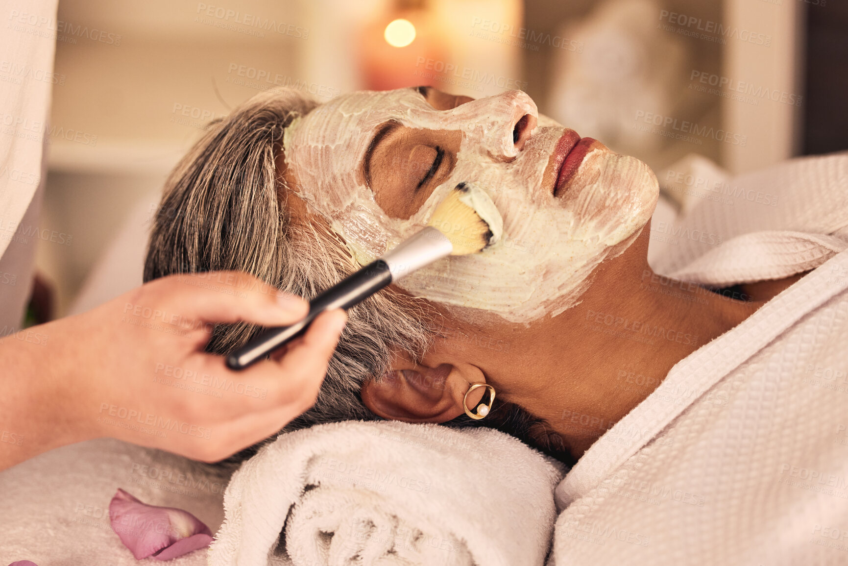 Buy stock photo Woman, spa and brush cream face mask for skincare treatment, relax or detox at beauty salon. Calm mature female client at wellness resort for facial cleaning, hydration cosmetics and peeling for glow