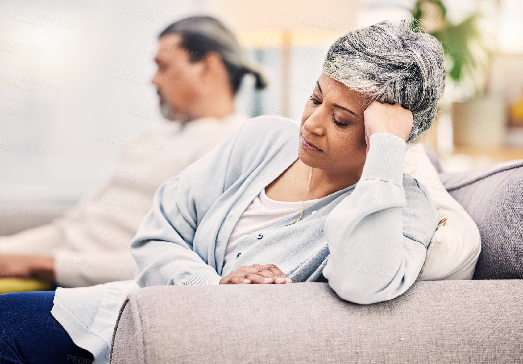 Buy stock photo Senior couple, divorce and argument on sofa in conflict, fight or disagreement in living room at home. Elderly man and woman in stress, depression or toxic relationship for cheating affair or breakup