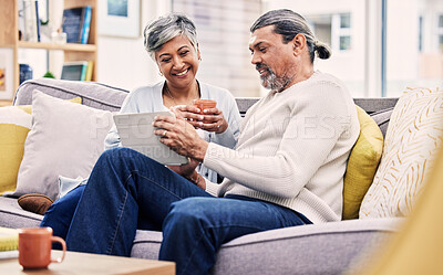 Buy stock photo Tablet, love and senior couple browsing on social media, mobile app or the internet on sofa. Conversation, relax and mature man and woman networking on an online website in the living room at home.