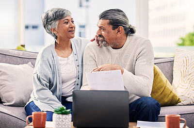 Buy stock photo Happy couple, planning and documents on laptop for finance, taxes or retirement goals and investment at home. Talking, sofa and senior people on sofa, life insurance and asset management on computer