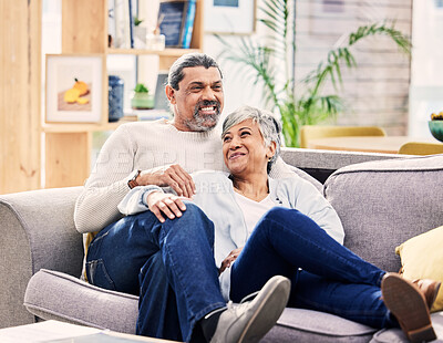 Buy stock photo Home, talking and senior couple on a sofa, love and relax with happiness, marriage and memory. Romantic, elderly woman or mature man on a couch, relationship or smile with quality time and bonding