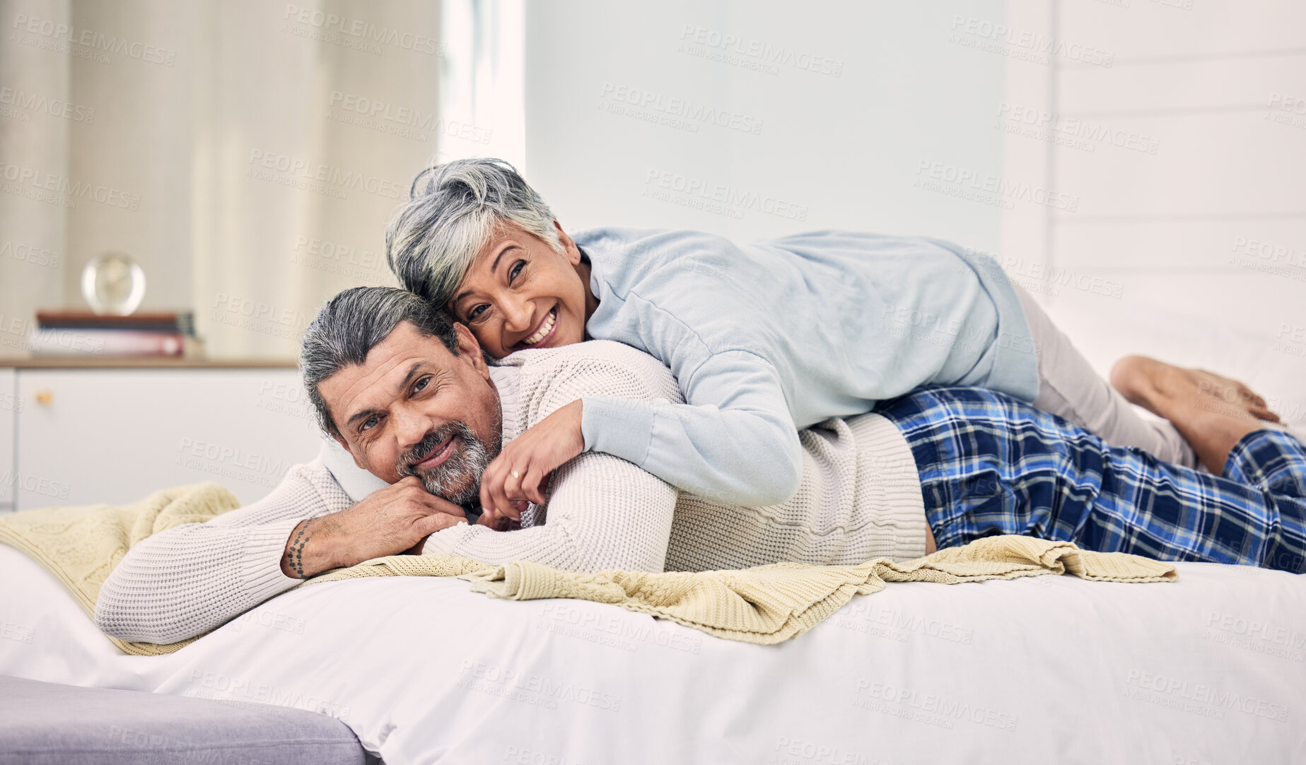 Buy stock photo Portrait, happy or old couple in bedroom to relax, enjoy romance or morning together at home. Affection, senior woman or elderly man laughing or bonding with love, support or smile in retirement 