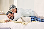 Hugging, laughing or old couple in bedroom to relax, enjoy romance or morning together at home. Trust, senior woman or happy elderly man lying or bonding with love, support or smile in retirement 