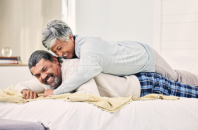 Buy stock photo Hugging, laughing or old couple in bedroom to relax, enjoy romance or morning together at home. Trust, senior woman or happy elderly man lying or bonding with love, support or smile in retirement 