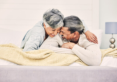 Buy stock photo Lying, love or old couple in bedroom to relax, enjoy romance or morning together at home. Hugging, silly and senior woman with happy elderly man laughing or bonding with joke or smile in retirement