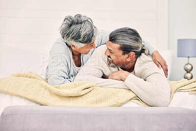 Buy stock photo Funny, playful or old couple in bedroom to relax, enjoy romance or morning time together at home. Hugging, silly senior woman or happy elderly man laughing or bonding with love or smile in retirement