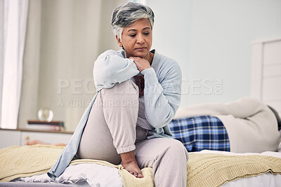 Buy stock photo Divorce, sad and senior woman with depression in bedroom or frustrated with problem or fear. Infidelity, marriage and fight with elderly female with stress in home or angry with partner or couple.