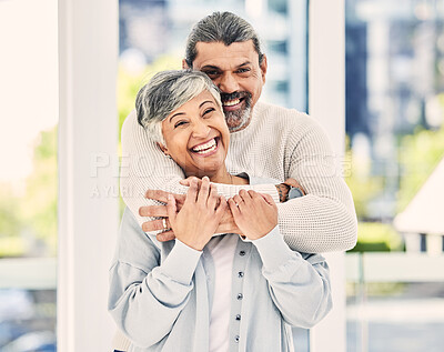 Buy stock photo Funny, portrait and elderly couple hug in home, laugh and relax in retirement together. Face, embrace and senior man and woman smile for love, care and support, commitment and loyalty in marriage.