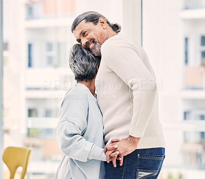 Buy stock photo Hug, holding hands or old couple dancing in living room for love, care or joy bonding together at home. Happy, elderly man or senior woman in celebration for anniversary or romance in retirement