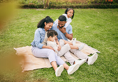 Buy stock photo Playful, park and family with love, happy and quality time to relax, bonding and loving together. Parents, mother on the grass and father with children, kids and fun outdoor, cheerful and happiness