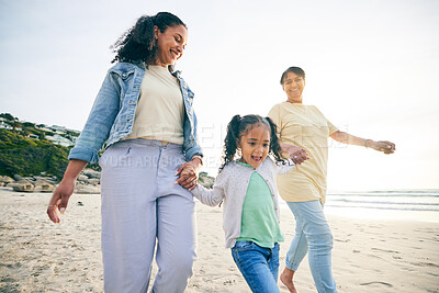 Buy stock photo Happy, family and holding hands at the beach while walking for freedom, travel and holiday by the sea. Smile, care and a mother, grandmother and child at the ocean for bonding, vacation or together