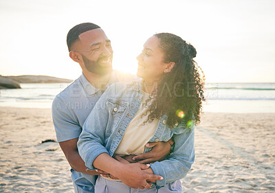 Buy stock photo Hug, beach and couple with love, vacation and marriage with happiness, summer holiday and relax. Romance, happy man and woman embrace, seaside and lens flare with relationship, sunset and adventure