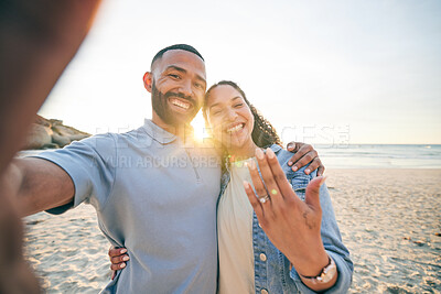 Buy stock photo Beach, selfie and couple with engagement ring, happy portrait and celebration of love for social media. Live streaming, video call and excited woman and man for marriage and life together by ocean