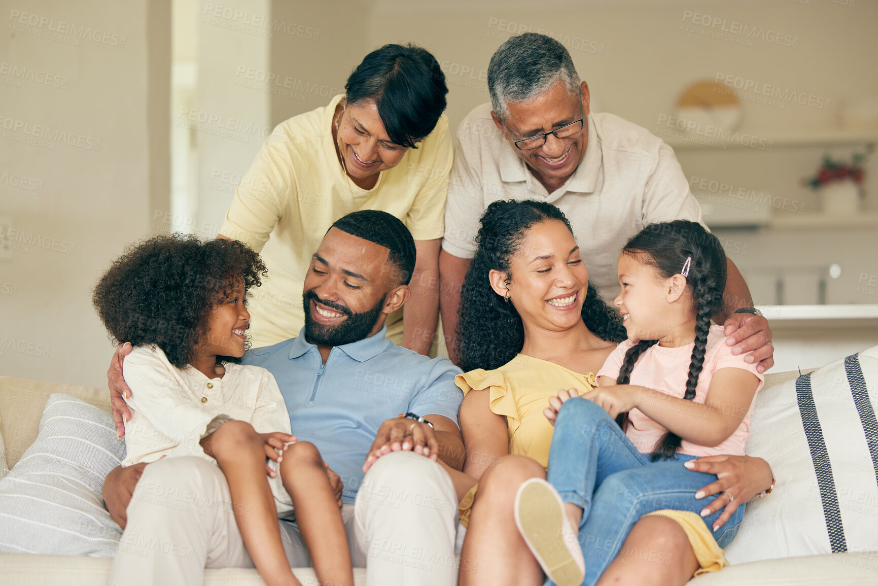 Buy stock photo Parents, kids and happy big family in home for love, care and quality time together. Mother, father and grandparents relax with young children in living room in support, smile and bond of generations