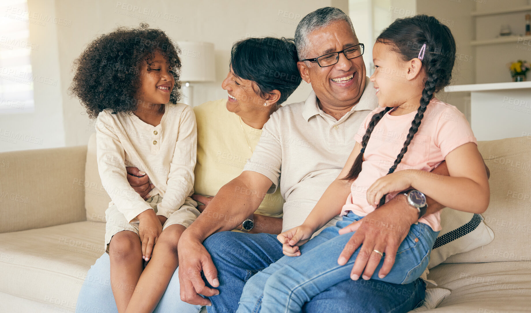 Buy stock photo Grandparents, children and smile on sofa in home for love, care and quality time together. Grandmother, grandfather and happy young kids relax on couch for bond, support and fun in family living room