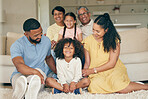 Parents, children and big family in home of love, care and quality time together. Mother, father and portrait of grandparents relax with young kids in lounge for support, smile or bond of generations