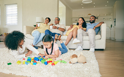Buy stock photo Big family, toys and children playing with parents and grandparents in lounge at home together for creative fun. Living room, happy and development of kids on carpet floor with games by mom and dad