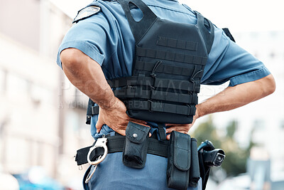 Buy stock photo Back pain, man or police officer with injury in city from accident crime, crisis danger or gunshot emergency. Law closeup, injured or security guard with painful joint, inflammation or wound in town