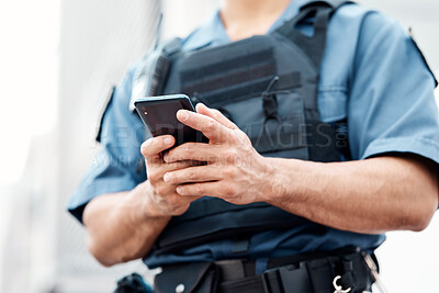 Buy stock photo Man, police and hands with phone for networking, communication or social media in the city. Closeup of male person or officer typing, texting or chatting on mobile smartphone app in an urban town