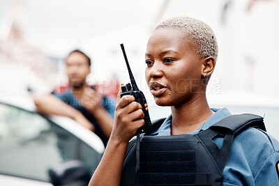 Buy stock photo Black woman, police and walkie talkie for radio in city communication, reinforcement or emergency. African female person, security guard or cop calling backup for crime on patrol in urban town street