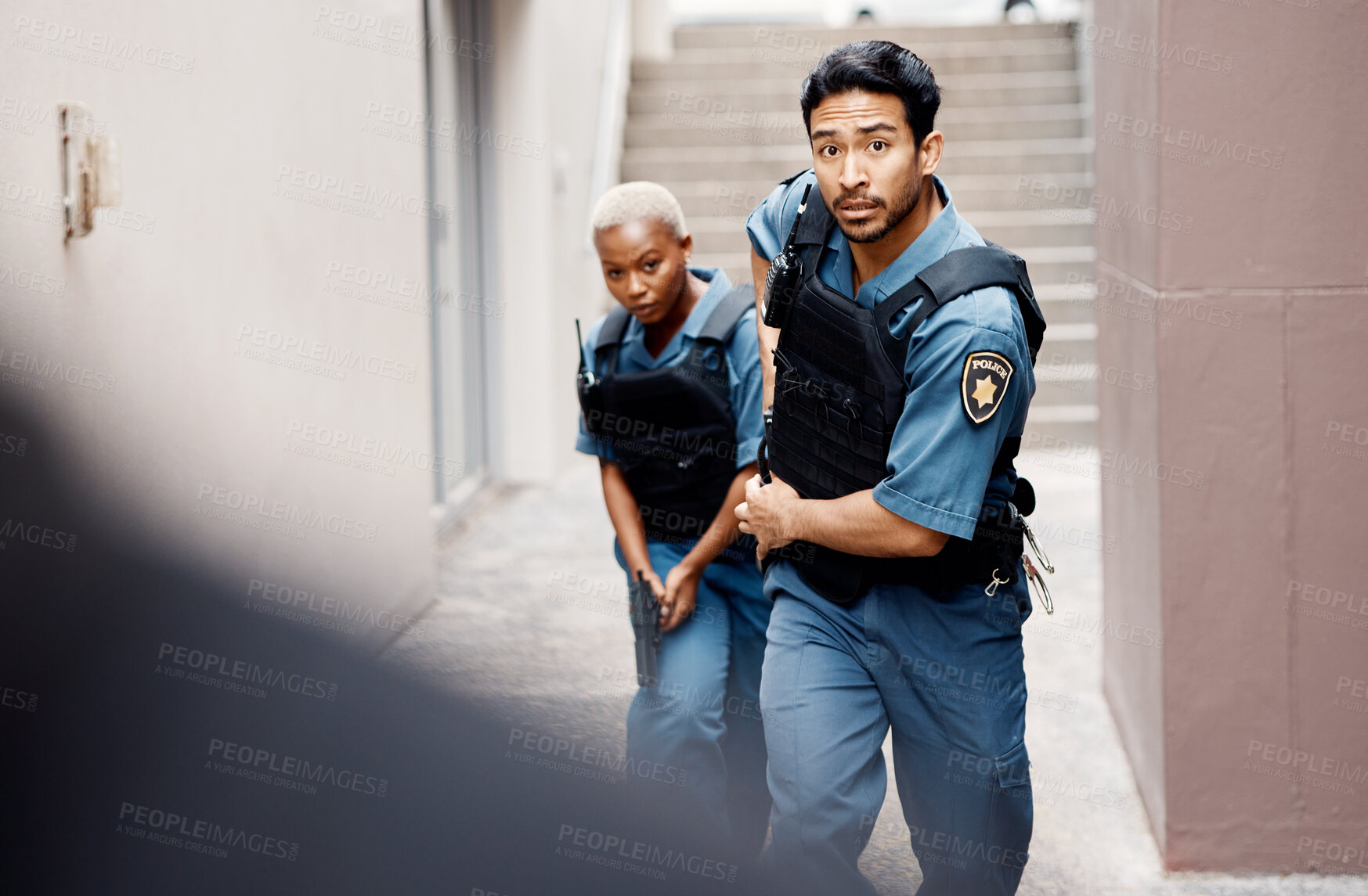 Buy stock photo Asian man, police and gun running in city for suspect, investigation or catching criminal together. Serious male person, security guard or cop with partner for backup or crime in alley of urban town