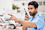 Security man, radio and point in street for inspection, law or warning with call, backup and city. Police officer, outdoor and communication to stop crime on walkie talkie, public services or safety