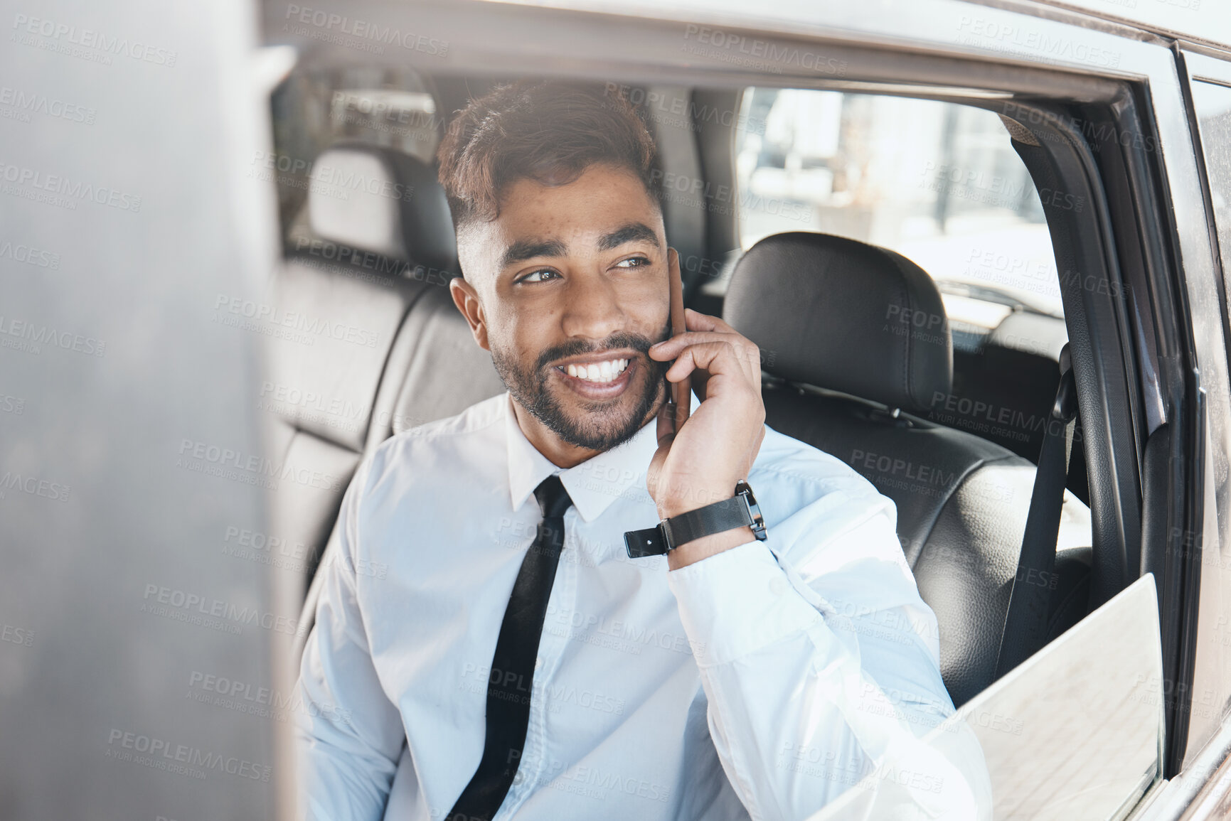 Buy stock photo Thinking, happy and businessman on phone call in a car for travel communication and work. Smile, ideas and a young corporate employee in a taxi or transport while speaking on a mobile in the morning