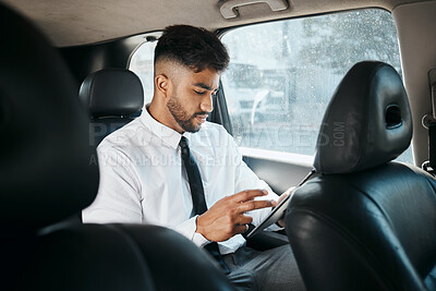 Buy stock photo Business man, tablet and drive in car for online search, trading or reading stock market news in traffic. Indian trader, focus and scroll on digital tech app, financial website or travel in transport