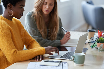 Buy stock photo Teamwork, students and women with a laptop at desk in university for learning knowledge. Collaboration, serious friends and computer in college for education, streaming video or study online for exam