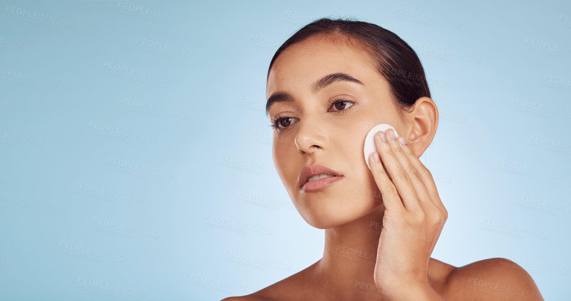 Buy stock photo Woman, cotton pad and face, natural beauty and remove makeup with mockup space isolated on blue background. Female model, facial and skincare, dermatology and cosmetic care with product in studio