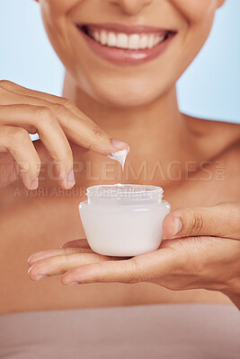 Buy stock photo Cream in container, beauty and woman hands with skincare, cosmetic product on blue background. Closeup, moisturizer and lotion for skin, sunscreen and dermatology, female person and anti aging