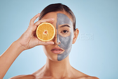 Buy stock photo Portrait, orange and mask for beauty with a woman in studio on a blue background for antiaging skincare. Face, facial and fruit with an attractive young female holding citrus for natural treatment