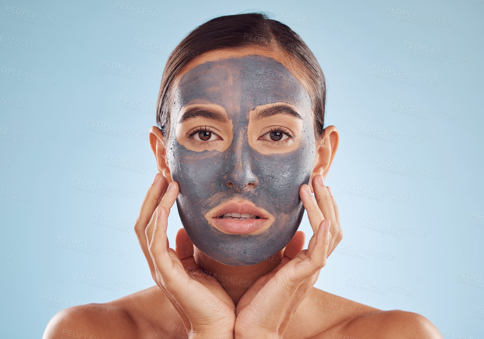 Buy stock photo Face mask, skincare and woman with beauty, dermatology and girl on a blue studio background. Portrait, female person and model with cosmetics, glow and aesthetic with hygiene, hydration and charcoal