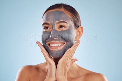 Buy stock photo Woman, charcoal face mask and thinking of skincare, natural beauty and cosmetics benefits on studio, blue background. Happy person or model with facial collagen and healthy skin care for dermatology