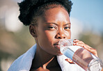 Face of black woman, portrait and drinking water for sports break, energy and workout, training and diet. Thirsty female athlete, bottle and nutrition for hydration, exercise and recovery of runner