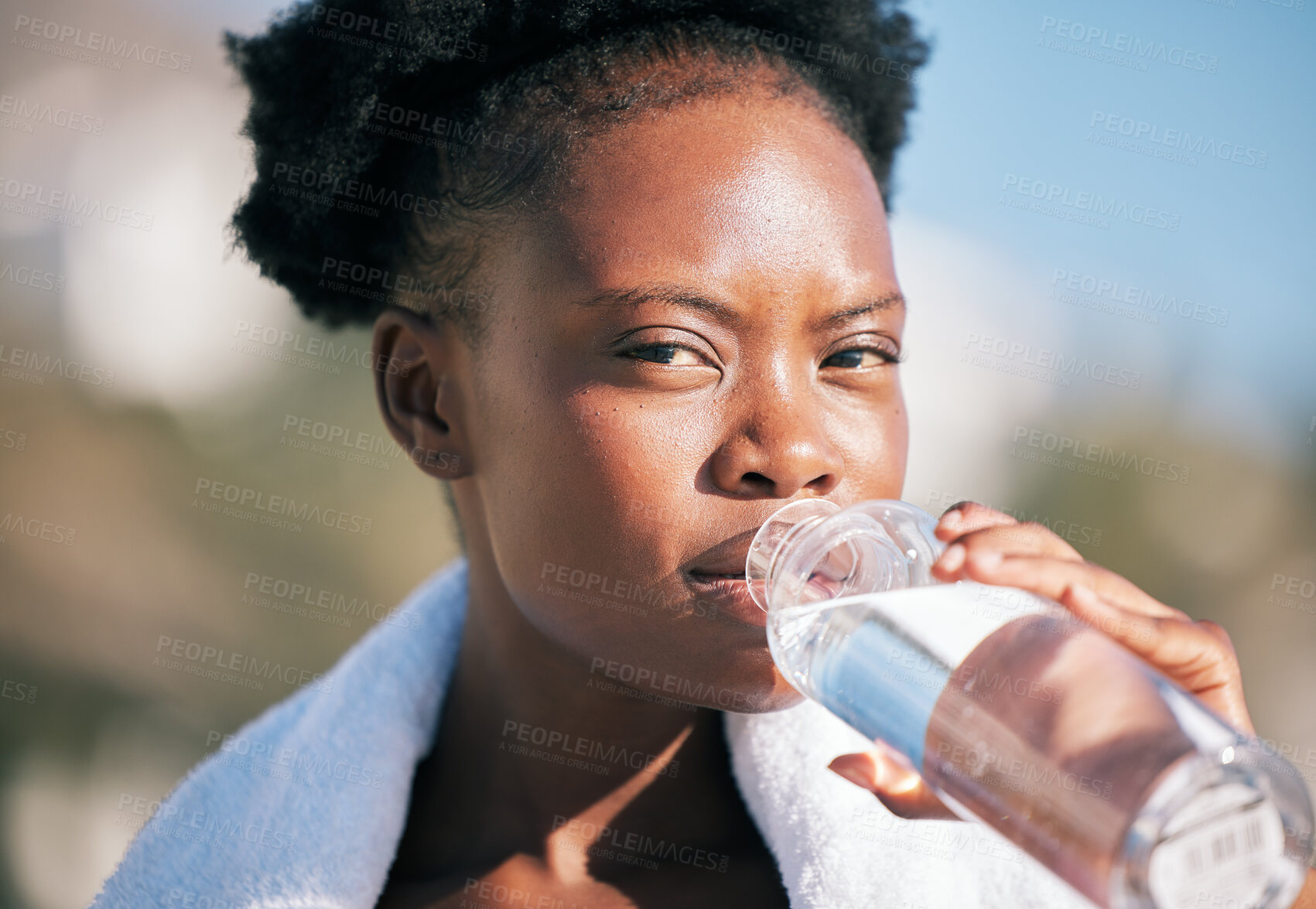 Buy stock photo Face of black woman and drinking water for sports break, energy and workout, training and diet. Portrait of thirsty female athlete, bottle and nutrition for hydration, exercise and recovery of runner