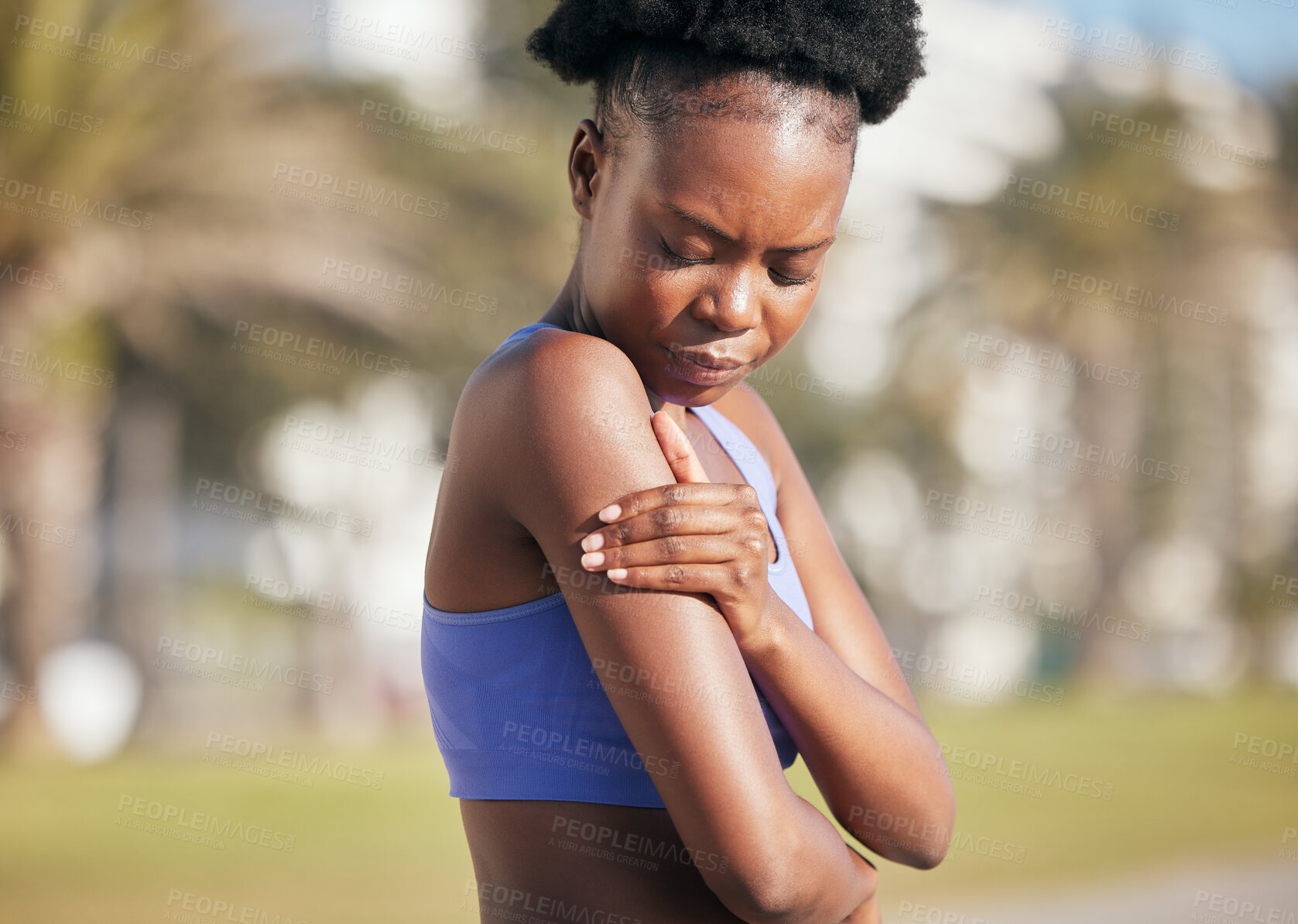 Buy stock photo Arm, pain and black woman in outdoor with injury from sport with strain from training accident. Cardio, muscle and shoulder inflammation with female athlete after exercise at park for workout.