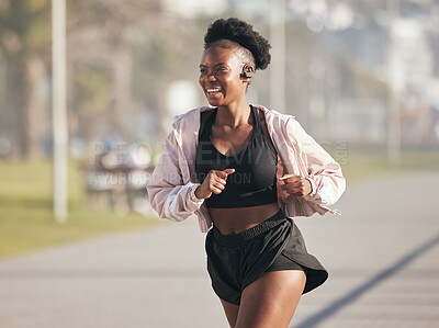 Buy stock photo Fitness, black woman and running outdoor with music earphones for listening to radio on podcast. Sports, smile and happy African athlete training, workout and exercise for health, wellness or cardio