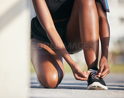 Buy stock photo Outdoor, hands and runner tie shoes to start workout, training or exercise. Sports, fitness and athlete tying laces on sneakers to prepare for cardio, running and jog for health or wellness on ground