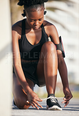 Buy stock photo Black woman, outdoor and tie shoes for workout, training and exercise. Sports, fitness and African athlete tying laces on sneakers to start running, prepare for cardio and jog, health and wellness