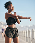 Fitness, vision and stretching with a black woman runner outdoor on a blurred background for cardio or endurance training. Exercise, sports and music with a young athlete getting ready for a workout