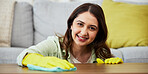 Woman, cleaning and table in portrait with gloves in home for dust, dirt and hygiene on table. Happy, face and girl wipes dust in living room for housework with hands for maintenance in apartment.