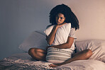 Sad, woman and bedroom with thinking and pillow hug at home with anxiety. House, female person and depression about mental health problem on a bed with stress, frustrated and lonely with mockup space