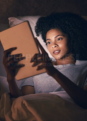 Buy stock photo Woman, tablet and bed with reading in dark room, typing and search for video, chat and social network. African girl, tech and relax in night, home and scroll for thinking, info and choice for movie