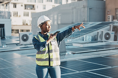 Buy stock photo Black woman point, solar panel and speaker phone call for photovoltaic plate, renewable energy grid or project voice note. Rooftop view, cellphone and female engineer talk about construction building